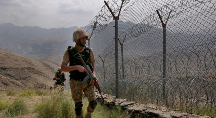 FILE - Pakistan Army troops patrol the Pakistan-Afghanistan border in Khyber district, Pakistan, Aug. 3, 2021.