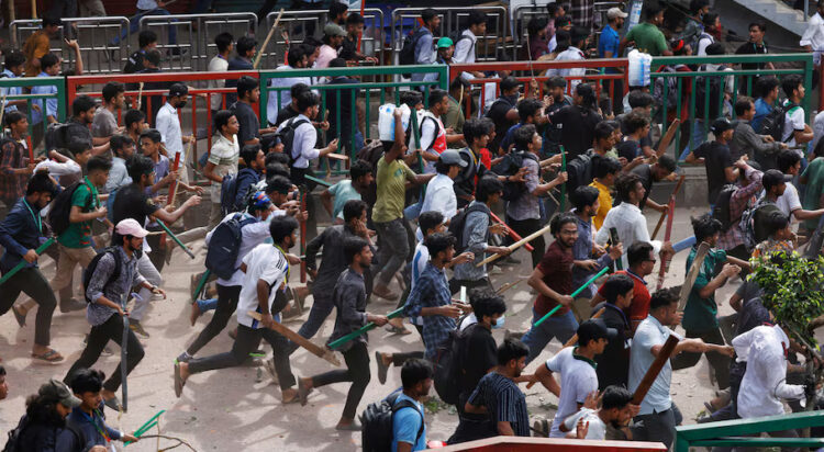 Bangladesh Chhatra League, the student wing of the ruling party Bangladesh Awami League, and anti-quota protesters engage in a clash at the Dhaka College area, in Dhaka, Bangladesh, July 16, 2024. REUTERS/Mohammad Ponir Hossain