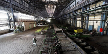 FILE A man walks past machines at the hot strip mill department of the Pakistan Steel Mills (PSM) on the outskirts of Karachi on February 8, 2016. (REUTERS/File)