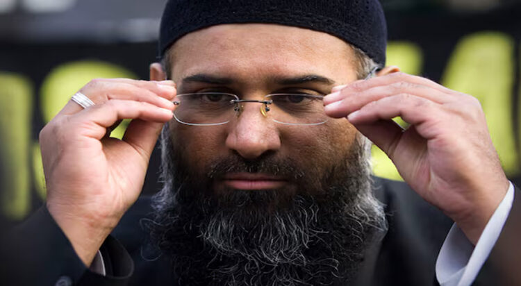 Islamic preacher Anjem Choudary addresses members of the media during a protest supporting the Shari'ah Law, in north London October 31, 2009. REUTERS/Tal Cohen/Files/File Photo