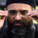 Islamic preacher Anjem Choudary addresses members of the media during a protest supporting the Shari'ah Law, in north London October 31, 2009. REUTERS/Tal Cohen/Files/File Photo