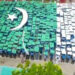 1,200 students form a huge flag in Pakpattan. — APP