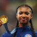 Paris 2024 Olympics - Athletics - Women's 100m Hurdles Victory Ceremony - Stade de France, Saint-Denis, France - August 10, 2024. Gold medallist Masai Russell of United States celebrates on the podium. REUTERS/Aleksandra Szmigiel