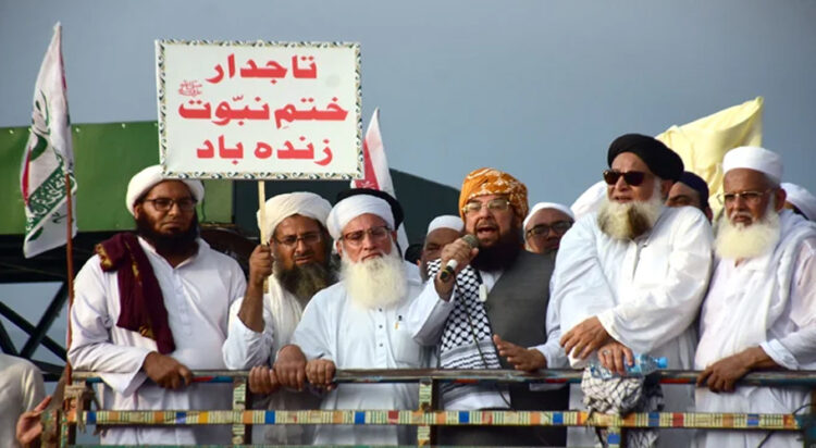 Jamiat Ulema-e-Islam-Fazl (JUI-F) leader Maulana Abdul Ghafoor Haideri (centre) addresses a protest in Islamabad on August 19, 2024. — Online