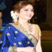 Nita wore a traditionally draped lehenga with parrot green skirt and royal blue dupatta. (Image: india.com)