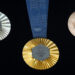 The Paris 2024 Olympic medals are pictured at the Paris Olympic organizers in Saint-Denis, outside Paris, Thursday, Feb. 8, 2024. A hexagonal, polished piece of iron taken from the iconic Eiffel Tower landmark is being embedded in each gold, silver and bronze medal that will be hung around athletes' necks at the July 26-Aug. 11 Paris Games and Paralympics that follow. (AP Photo/Thibault Camus)
Thibault Camus