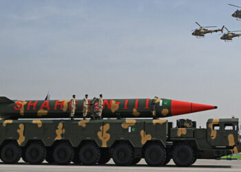 Pakistani military helicopters fly past a vehicle carrying a long-range ballistic Shaheen III missile take part in a military parade to mark Pakistan's National Day in Islamabad on March 25, 2021. (AFP/File)