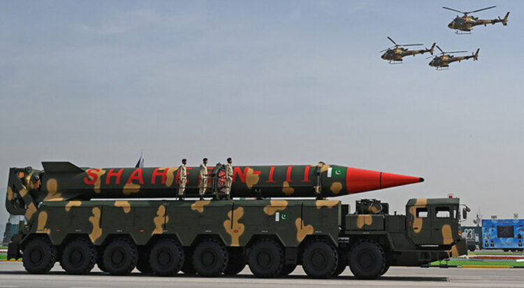 Pakistani military helicopters fly past a vehicle carrying a long-range ballistic Shaheen III missile take part in a military parade to mark Pakistan's National Day in Islamabad on March 25, 2021. (AFP/File)