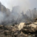 A man walks on the rubble of damaged buildings in the aftermath of Israeli air strikes on Beirut's southern suburbs, Lebanon September 28, 2024. REUTERS/Ali Alloush