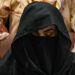 Bushra Bibi, the wife of PTI founder Imran Khan, is seen seated at a registrar office in the Lahore High Court on July 17, 2023. — AFP