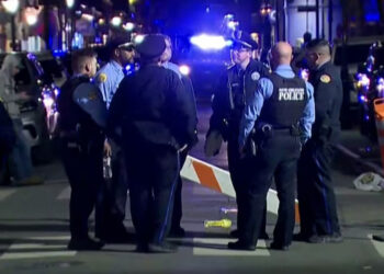 Police officers stand at the scene where a truck drove into a large crowd on Bourbon Street in the French Quarter of New Orleans, Louisiana, U.S. January 1, 2025 in this screengrab taken from a video. ABC Affiliate WGNO/Handout via REUTERS