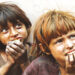 Scavenger children in Lahore, who collect recyclable items from garbage to earn their living, wait for a garbage truck in this file photo. (Image: AP/File)