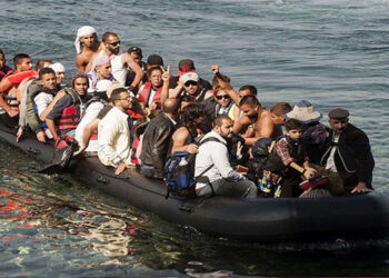 Refugees arrive on the shore of Sykamias beach, west of the port city of Mytilini, after crossing the Aegean sea from Turkey in Lesvos Island, Greece. Credit: Photo: File/AFP/Getty