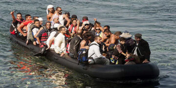 Refugees arrive on the shore of Sykamias beach, west of the port city of Mytilini, after crossing the Aegean sea from Turkey in Lesvos Island, Greece. Credit: Photo: File/AFP/Getty