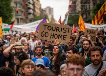 This file photo shows demonstrators shouting slogans against the Formula 1 Barcelona Fan Festival in downtown Barcelona (Image: AP)