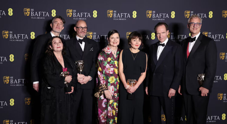 Peter Straughan, Tessa Ross, Edward Berger, Isabella Rossellini, Juliette Howell, Ralph Fiennes and Michael A. Jackman pose in the winners' room as "Conclave" won the award for Best Film during the 2025 British Academy of Film and Television Awards (BAFTA) at the Royal Festival Hall in the Southbank Centre, London, Britain, February 16, 2025. REUTERS/Isabel Infantes
