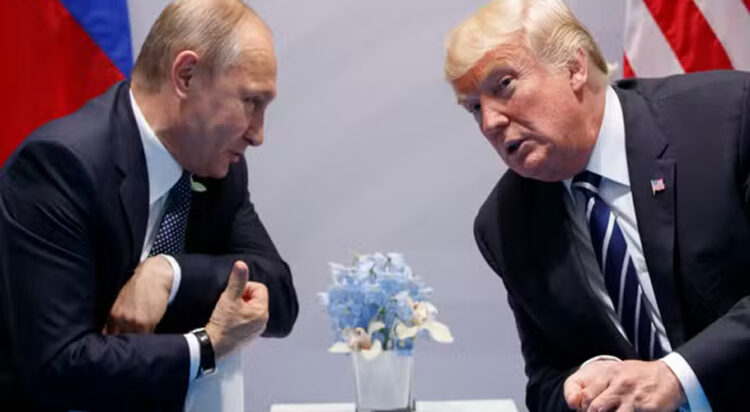 In this file photo taken on July 7, 2017, then US president Donald Trump meets with Russian President Vladimir Putin at the G-20 Summit in Hamburg, Germany. EVAN VUCCI / AP