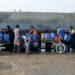 Vendors load cans of drinking water for sale on their motorcycle carts, as they fill them from a private water supply plant in Jacobabad in southern Sindh province on February 18. — AFP
