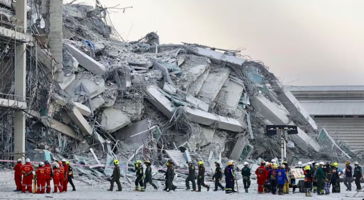 Rescuers work at the site a high-rise building under construction that collapsed after a 7.7 magnitude earthquake in Bangkok, Thailand (Source: Associated Press)