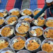 Volunteers arrange plates of iftar meals prepared for Muslims waiting to break their fast on the first day of the Islamic holy fasting month of Ramadan at Memon mosque in Karachi on March 2, 2025. (AFP)