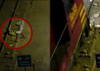 A man has survived being run over by a train while sleeping by train tracks in Peru (Screengrab)