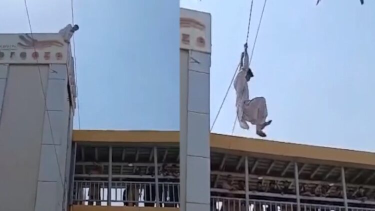 Robber seen hanging on wire in Karachi. Screen grab