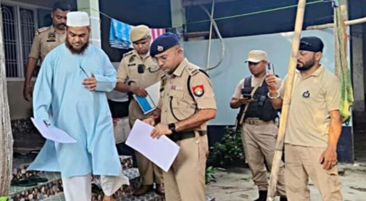 All India United Democratic Front (AIUDF) MLA Aminul Islam being arrested in Nagaon district, Assam, on Thursday, April 24, 2025. | Photo Credit: PTI