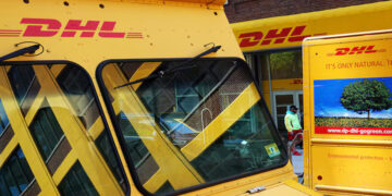Trucks are parked outside a DHL delivery facility in Manhattan, New York City, U.S., May 9, 2022. REUTERS/Andrew Kelly