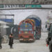 Goods carrier trucks cross into Pakistan at the zero point Torkham border crossing between Afghanistan and Pakistan, in Nangarhar province on February 25, 2023. (AFP/File)