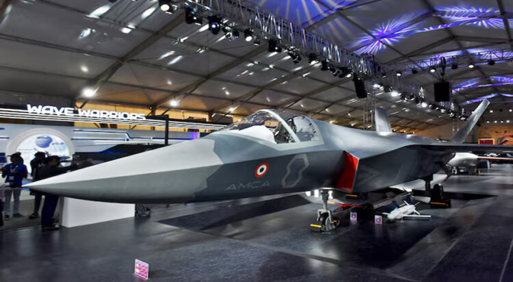Visitors stand next to a prototype of the Advanced Medium Combat Aircraft (AMCA), India's most advanced stealth fighter jet, at the "Aero India 2025" air show at Yelahanka air base in Bengaluru, India, February 11, 2025. REUTERS/Stringer/File Photo