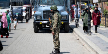 An Indian paramilitary soldier stands guard along a street in Srinagar on May 14, 2025. (AFP/File)