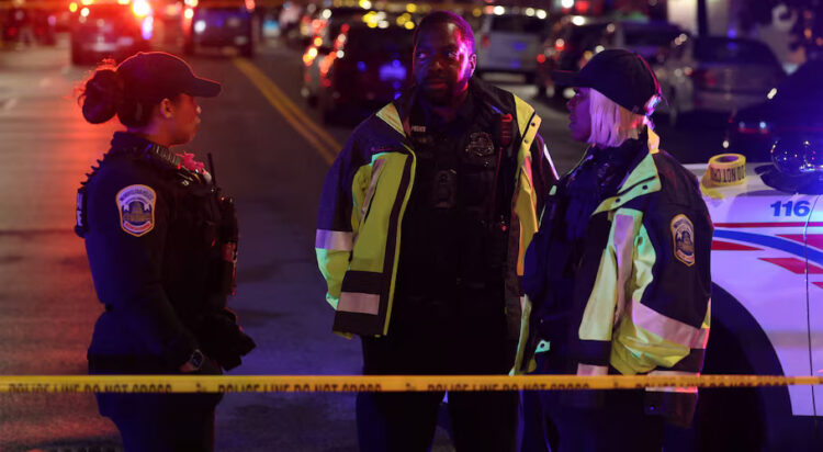Police officers work at the site where, according to the U.S. Homeland Security Secretary, two Israeli embassy staff were shot dead near the Capital Jewish Museum in Washington, D.C., U.S. May 21, 2025. REUTERS/Jonathan Ernst