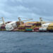 The photograph taken and released on May 25, 2025, by the Indian Defense Public Relations Office (PRO) of Mumbai, shows a Liberian-flagged container ship off India’s southern coast of Kerala. (Courtesy: Indian Defense PRO)
