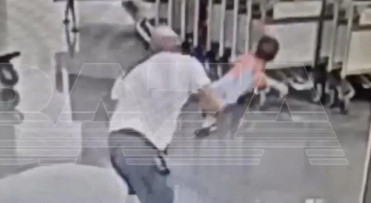 CCTV footage shows the tourist walked up to the little boy and slams him to the ground