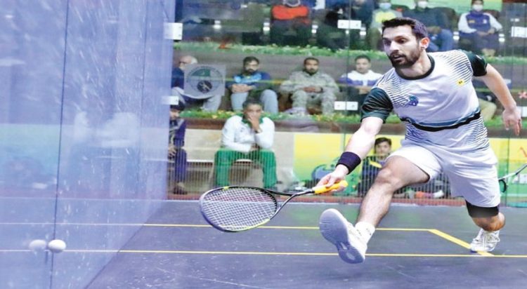 File/ Nasir Iqbal in action during his Asian Individual Squash Championship quarter-final against Leung Chi Hin Henry of Hong Kong at the Mushaf Squash Complex on December 18, 202. (APP)