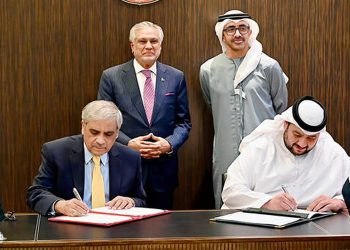 Pakistan Deputy Prime Minister Ishaq Dar (center left) and the United Arab Emirates Foreign Minister Sheikh Abdullah bin Zayed in Abu Dhabi (center right) observe the signing of the agreement after the 12th session of the Pakistan-UAE Joint Ministerial Commission (JMC), in Abu Dhabi, UAE, on June 24, 2025. (Pakistan's Foreign Office)