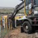 A crane operator attempts to recover an overturned bus from a water canal in Pakistan's southern district of Thatta on July 20, 2025. (Rescue Service Thatta)