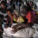 Relatives mourn after receiving the dead body of a victim who was killed in a stampede that broke out during a campaign rally last evening in the Karur district, in the Indian state of Tamil Nadu, on September 28. — AFP