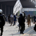 Activists of the Tehreek-e-Labbaik Pakistan (TLP) party clash with police after authorities blocked the road with shipping containers, in Lahore on October 10, 2025, ahead of their pro-Palestinian march towards Islamabad. (AFP/File)