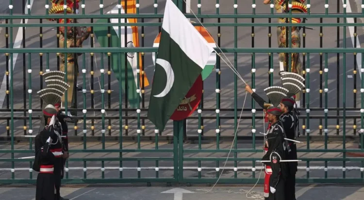 Pakistan's Rangers soldiers and Indian Border Security Forces soldiers lower their flags during a daily closing ceremony at the Wagah, on Pakistan and India border, near Lahore, Pakistan, May 5, 2025. (AP Photo)