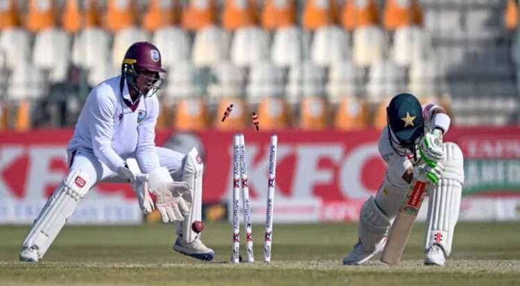 Pakistan's Mohammad Rizwan was clean bowled by Jomel Warrican for one of his five wickets in Pakistan's second innings as he led his side's win in the second Test match in Multan [Farooq Naeem/AFP]