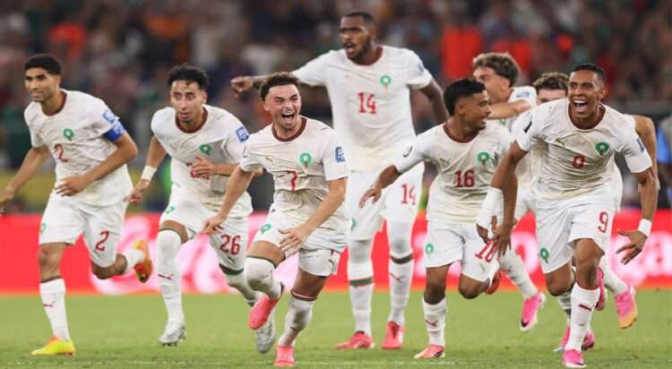 Morocco players dash to celebrate with Ismael Saibari after he scored Morocco's winning penalty.
Photograph: Carl Recine/Getty Images