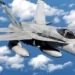 A U.S. Marine Corps F/A-18C in October 2003, flying over the South China Sea.