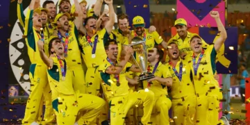 ICC Cricket World Cup 2023 - Final - India v Australia - Narendra Modi Stadium, Ahmedabad, India - November 19, 2023 Australia's Pat Cummins celebrates with the trophy and teammates after winning the ICC Cricket World Cup REUTERS/Adnan Abidi