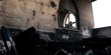 A Palestinian man inspects the damage at a mosque, which Palestinians say was damaged by Israeli settlers, in Qusra near Nablus, in the Israeli-occupied West Bank, July 26, 2026. — Reuters