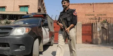 This file photo shows a police official standing in Quetta.